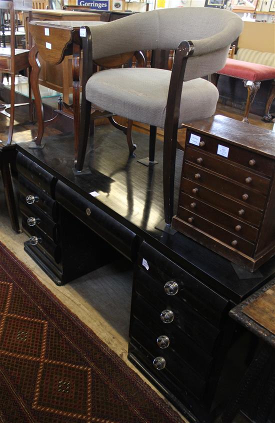 Art Deco style ebonised desk with shaped front, with five drawers with glass knob handles & chair(-)